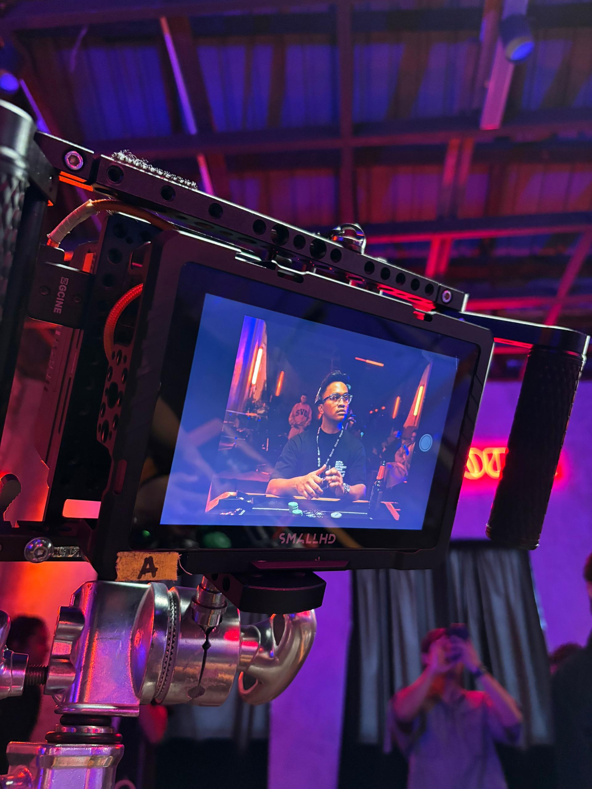 SmallHD director's monitor previewing a shot in a practical-lit interior